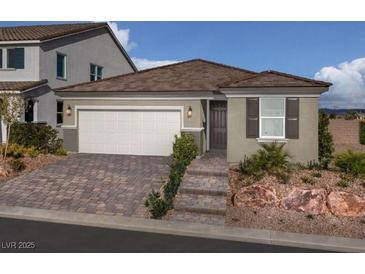 Single-story home with two-car garage and attractive landscaping at 9196 Oakdale Ranch Ct, Las Vegas, NV 89139