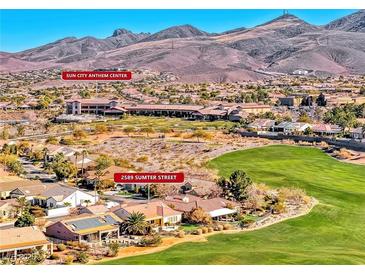 Aerial view of a residential community near mountains and golf course at 2589 Sumter St, Henderson, NV 89052