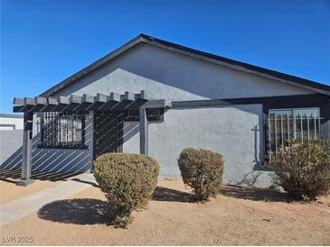 Single story home with landscaped front yard and covered entryway at 4017 Danford Pl, Las Vegas, NV 89102