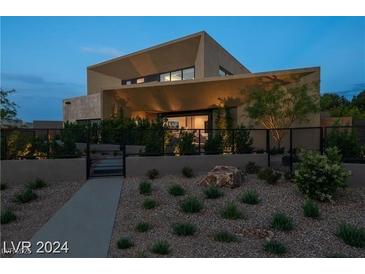 Modern home with clean lines and desert landscaping at 7310 Heron Canyon Ct, Las Vegas, NV 89117