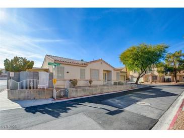 Single-story house with front yard and well-maintained landscaping at 7741 Orchard Wood Ct, Las Vegas, NV 89131