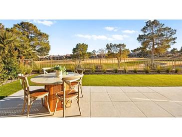 Outdoor patio with seating area, overlooking a golf course at 3016 Darby Falls Dr, Las Vegas, NV 89134