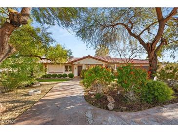 Attractive curb appeal with mature trees and landscaping at 4840 Conough Ln, Las Vegas, NV 89149