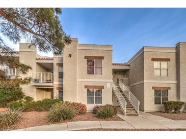 Exterior view of a two-story building with stairs and landscaping at 6800 E Lake Mead Blvd # 1047, Las Vegas, NV 89156