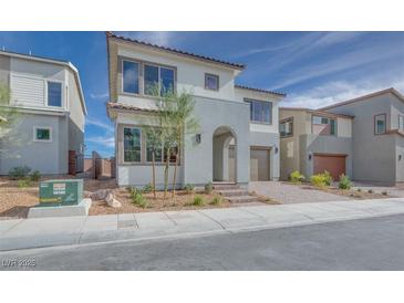 Two-story home with modern design, attached garage, and landscaping at 6828 Pacific Robin St, North Las Vegas, NV 89084