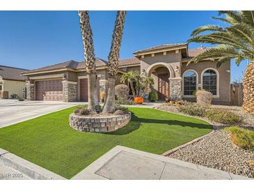 Single-story home with a three-car garage, artificial turf, and desert landscaping at 7131 Celadine St, Las Vegas, NV 89131