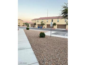 Landscaped front yard with gravel and walkway at 5197 Silica Chalk Ave, Las Vegas, NV 89115