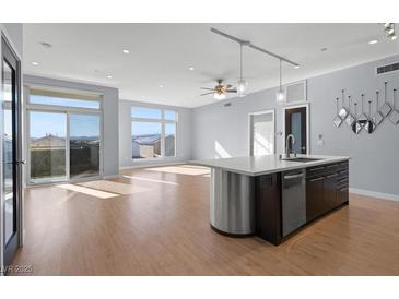 Open concept kitchen with island, stainless steel appliances, and ample counter space at 8925 W Flamingo Rd # 213, Las Vegas, NV 89147