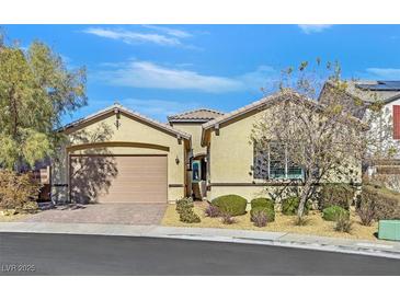 Single-story home with attached garage and landscaped front yard at 900 Mckinley View Ave, Henderson, NV 89012