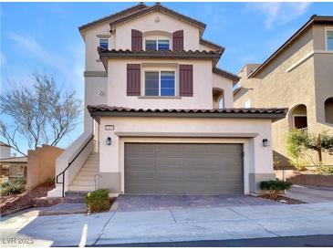 Charming two-story home featuring a two-car garage and neutral stucco exterior with lovely contrasting accents at 10809 Wrigley Field Ave, Las Vegas, NV 89166