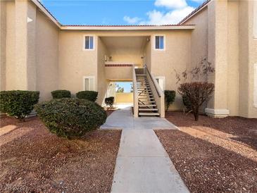 Building exterior showcasing stairs and landscaping at 7200 Pirates Cove Rd # 1008, Las Vegas, NV 89145