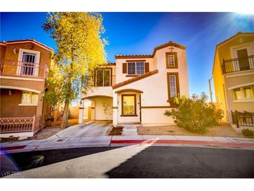 Two-story house with attached garage and landscaping at 10484 Beautiful Fruit St, Las Vegas, NV 89183