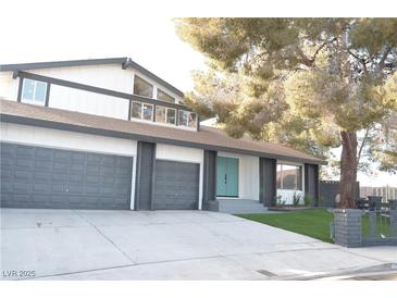 Stunning two-story home with a three-car garage and landscaped front yard at 1804 Piccolo Way, Las Vegas, NV 89146