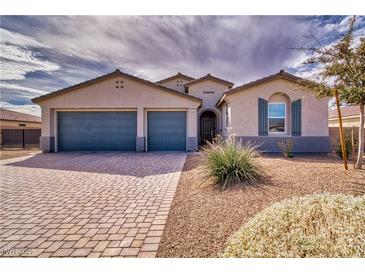 Charming single-story home with a three-car garage and low-maintenance desert landscaping at 4641 Sommerset Ct, Pahrump, NV 89061