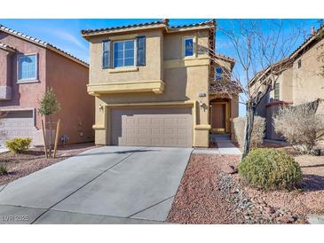 Two-story house with attached garage and desert landscaping at 5089 Sagelyn St, Las Vegas, NV 89122