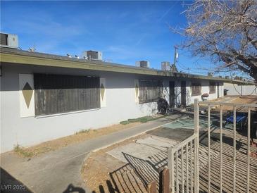 Ranch style multi unit building with parking and gated yard at 2516 Ellis St, North Las Vegas, NV 89030