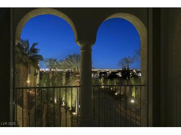 Night view of city skyline from private balcony with arched entryway at 2555 Hampton Rd # 4302, Henderson, NV 89052