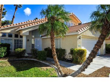 Two-story house with tile roof, palm trees, and a two-car garage at 5508 Big Sky, Las Vegas, NV 89149