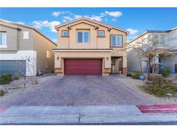 Two-story house with red door and garage at 7141 Liberty Landing St, Las Vegas, NV 89166