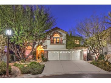 Elegant two-story home with brick accents and a three-car garage at 1705 Corta Bella Dr, Las Vegas, NV 89134