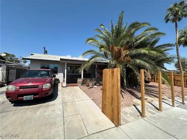 Ranch style home with carport and landscaped front yard at 1925 E Saint Louis Ave, Las Vegas, NV 89104