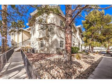 Attractive exterior of a two-story building with landscaping and walkway at 3320 S Fort Apache Rd # 125, Las Vegas, NV 89117