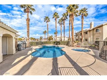 Inviting pool and spa area with palm trees, perfect for relaxation at 3320 S Fort Apache Rd # 125, Las Vegas, NV 89117