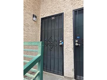 Condo building entrance with security gate and walkway at 510 Elm Dr # 205, Las Vegas, NV 89169