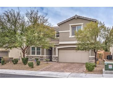 Charming two-story home featuring a neutral color scheme, manicured landscaping, and a two-car garage at 6403 Ava Ridge Ave, Las Vegas, NV 89141