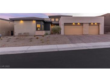 Stunning modern home with three-car garage and landscaped front yard at 11015 Sanctuary Cove Ct, Las Vegas, NV 89135