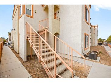 Exterior view of a two-story building with stairs and walkway at 4655 Gold Dust Ave # 210, Las Vegas, NV 89120
