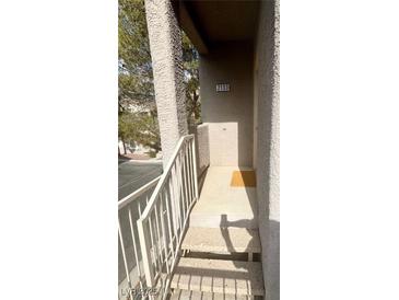 Exterior view of condo entrance with stairs and address number 2133 at 5250 S Rainbow Blvd # 2133, Las Vegas, NV 89118