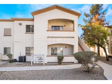 Two-story condo building with walkway and landscaping at 5655 E Sahara Ave # 2064, Las Vegas, NV 89142