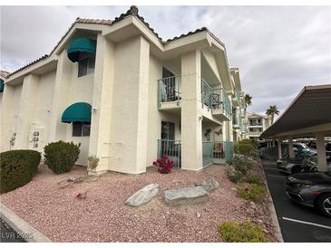 Exterior view of condo building with parking and landscaping at 3550 Bay Sands Dr # 1017, Laughlin, NV 89029