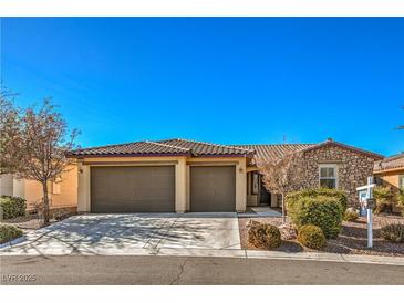 Single-story house with two-car garage and desert landscaping at 4880 Da Vinci Way, Pahrump, NV 89061