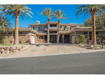 Two-story luxury home with stone accents and palm trees at 646 Saint Croix St, Henderson, NV 89012