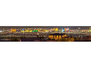 Stunning panoramic view of the Las Vegas strip at night from a home in the surrounding hills at 12 Oro Valley Dr, Henderson, NV 89052