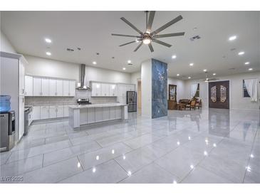 Spacious kitchen featuring modern white cabinets, large island, and high-end appliances at 1202 S Rancho Dr, Las Vegas, NV 89102