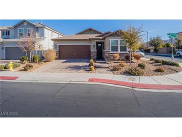 Single-story home with brown garage door and stone accents at 2242 Valdina St, Henderson, NV 89044