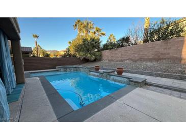 Inviting backyard pool with waterfall features at 2316 Mountain Rail Dr, North Las Vegas, NV 89084