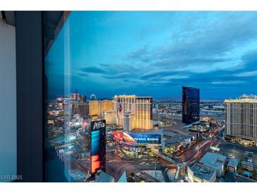 Stunning aerial view of Las Vegas skyline at dusk, showcasing city lights and iconic hotels at 3722 Las Vegas Blvd # 3102, Las Vegas, NV 89158