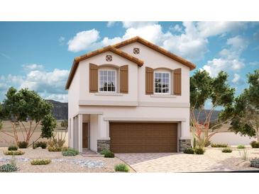 Two-story house with brown garage door and shutters, stone accents, and desert landscaping at 969 Ferodale Ave, North Las Vegas, NV 89084