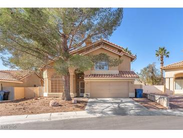 Charming two-story home with desert landscaping, a covered entry, and a two car garage at 5037 Monte Del Sol Ln, North Las Vegas, NV 89031