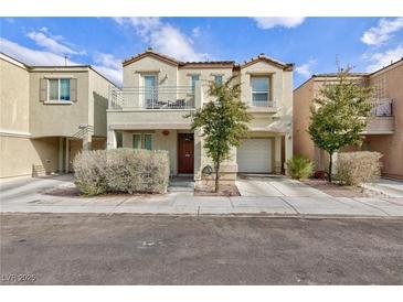 Two-story house with balcony, attached garage, and landscaping at 7660 Fabled Filigree St, Las Vegas, NV 89149