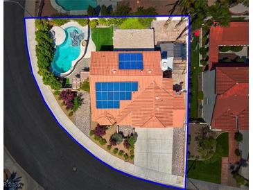 Aerial view of single story home with solar panels, pool, and landscaped yard at 2619 Grey Stone Rd, Henderson, NV 89074