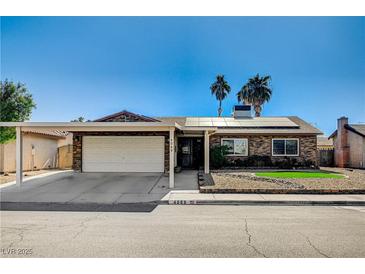 Single-story home with carport, solar panels, and landscaped front yard at 4089 Patterson Ave, Las Vegas, NV 89104