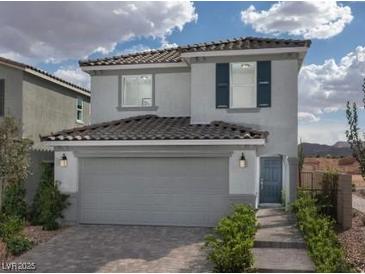 Two-story house with gray siding, a two-car garage, and landscaping at 4199 Nopal Serrano Ave, Las Vegas, NV 89141