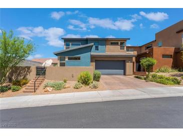 Two-story contemporary home with landscaped front yard and two-car garage at 7230 Galaxy Dune St, Las Vegas, NV 89148