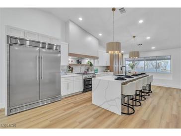 Modern kitchen with stainless steel appliances and large island at 3105 Siena Cir, Las Vegas, NV 89128