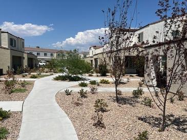 Landscaped community with paved pathways and desert landscaping at 3513 Golden Chariot Ave, Las Vegas, NV 89106